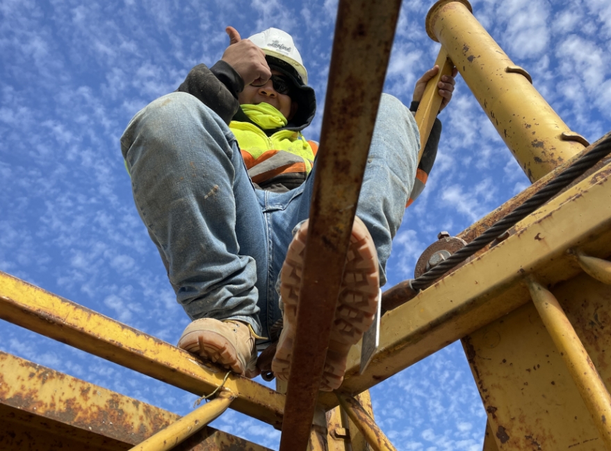 worker giving thumbs up