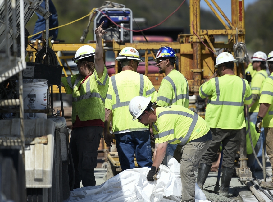 team in safety gear working on bridge